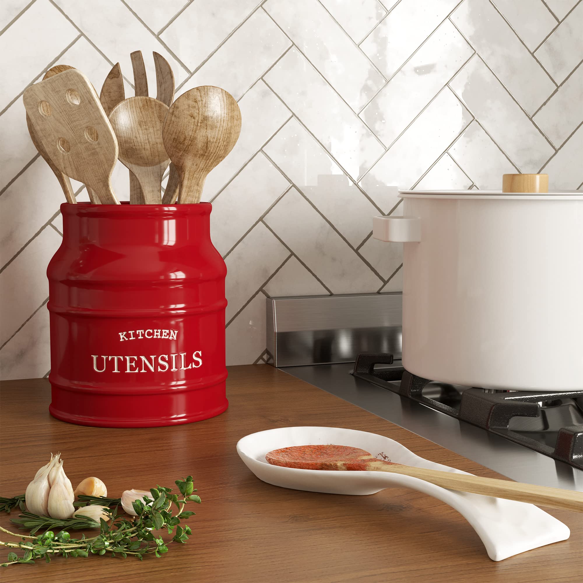 Barnyard Designs red ceramic utensil holder on counter, keeps kitchen essentials at hand.