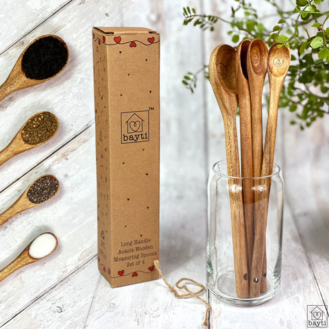 Bayti handcrafted acacia spoons with warm natural finish.
