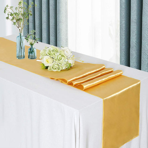 B-COOL Christmas party decor using gold satin runners for festive tables.