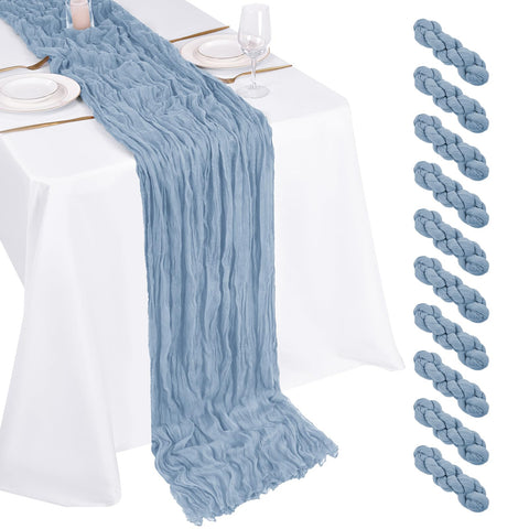 Beautane dusty blue cheesecloth table runner highlighting soft drape for weddings.