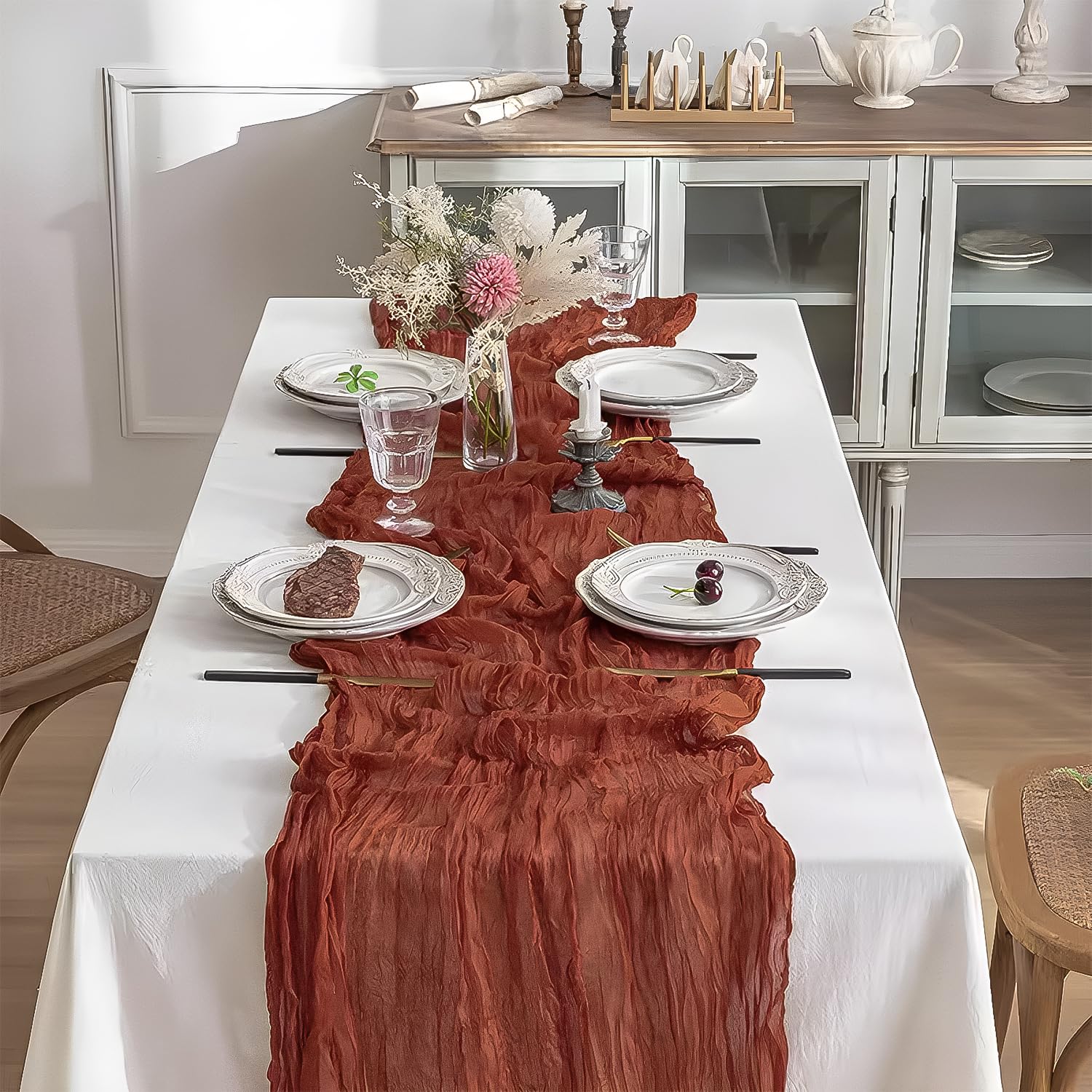 Beelify boho gauze table runner in rust adds soft, romantic ambience.