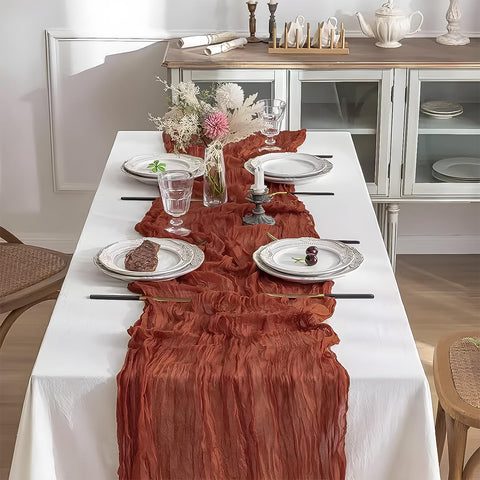 Beelify boho gauze table runner in rust adds soft, romantic ambience.