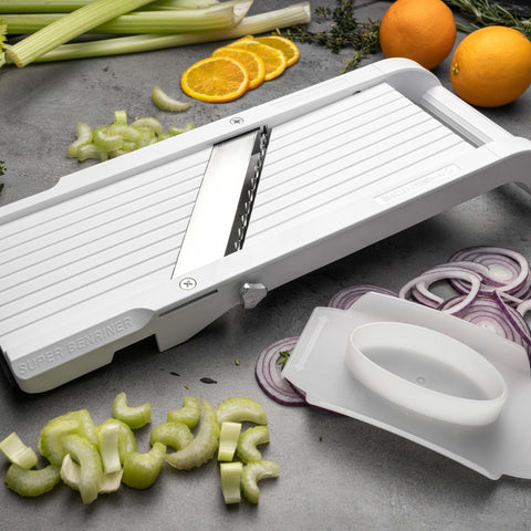 Benriner mandoline safety guard protects fingers while slicing small pieces safely.