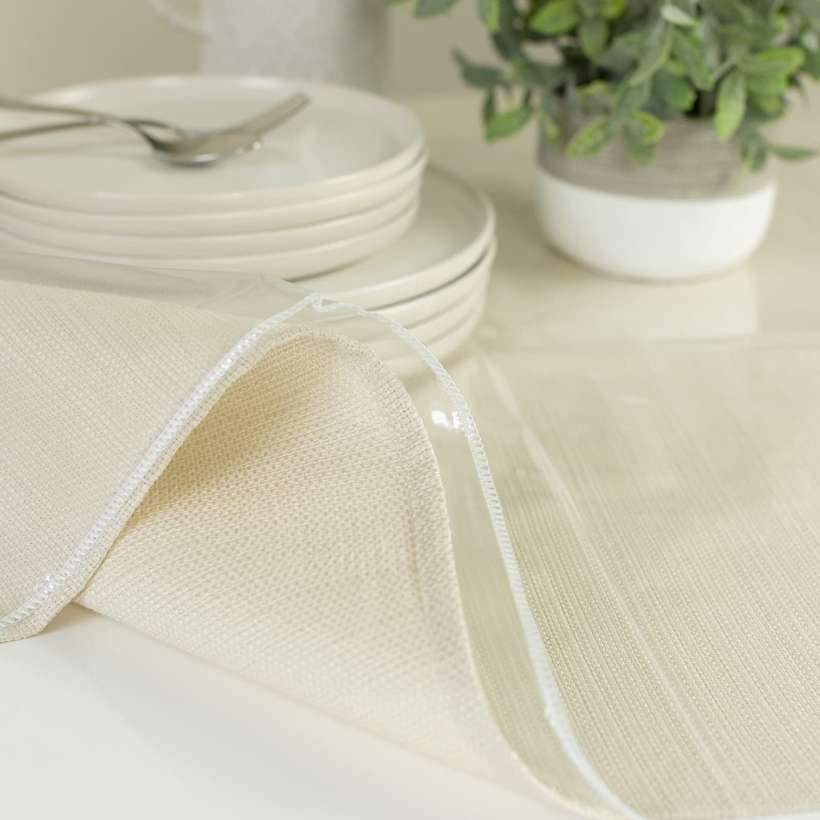 Benson Mills reusable plastic tablecloth protector 60x124 in a bright dining room