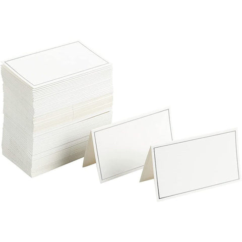 Best Paper Greetings folded place cards with white stock and silver foil border for events.