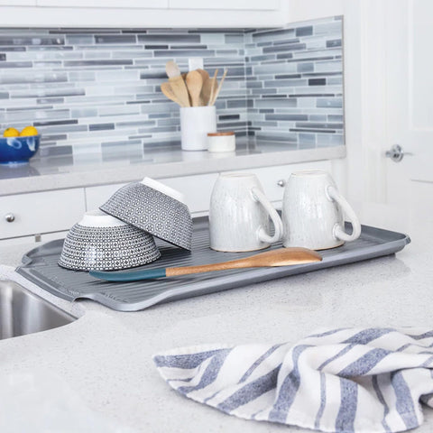 Better Houseware Dish Drainer Mat under a dish rack with dried dishes.