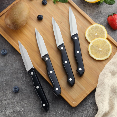 BEWOS paring knife in use peeling small vegetables