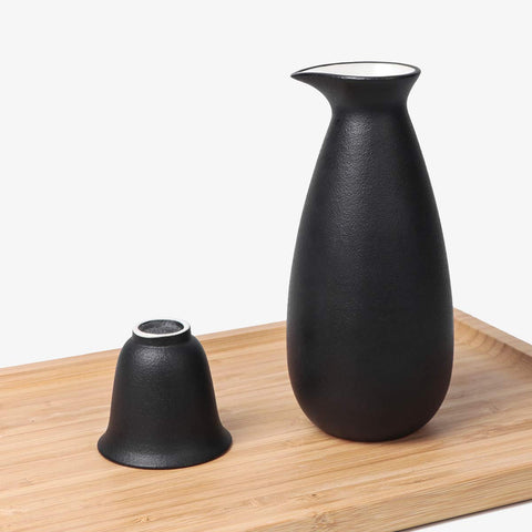 Bgbg candle stove safely heats sake on a warming surface.