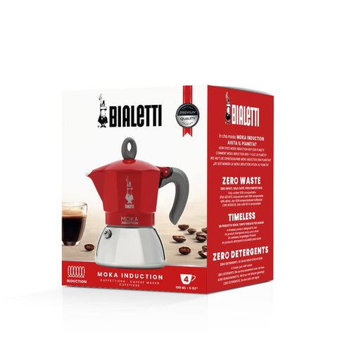 Bialetti Moka Induction stainless steel boiler shines beside the red pot