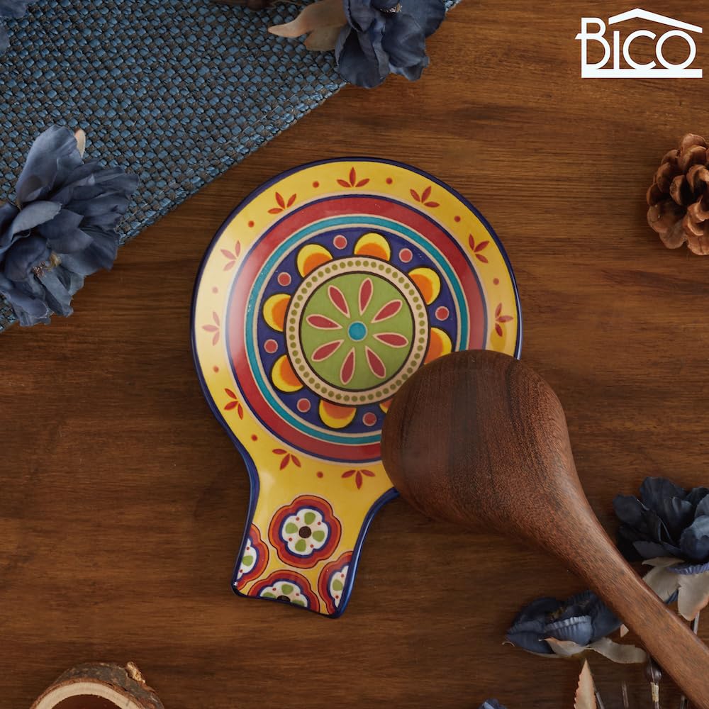 Compact rest holds spoons and spatulas during cooking.