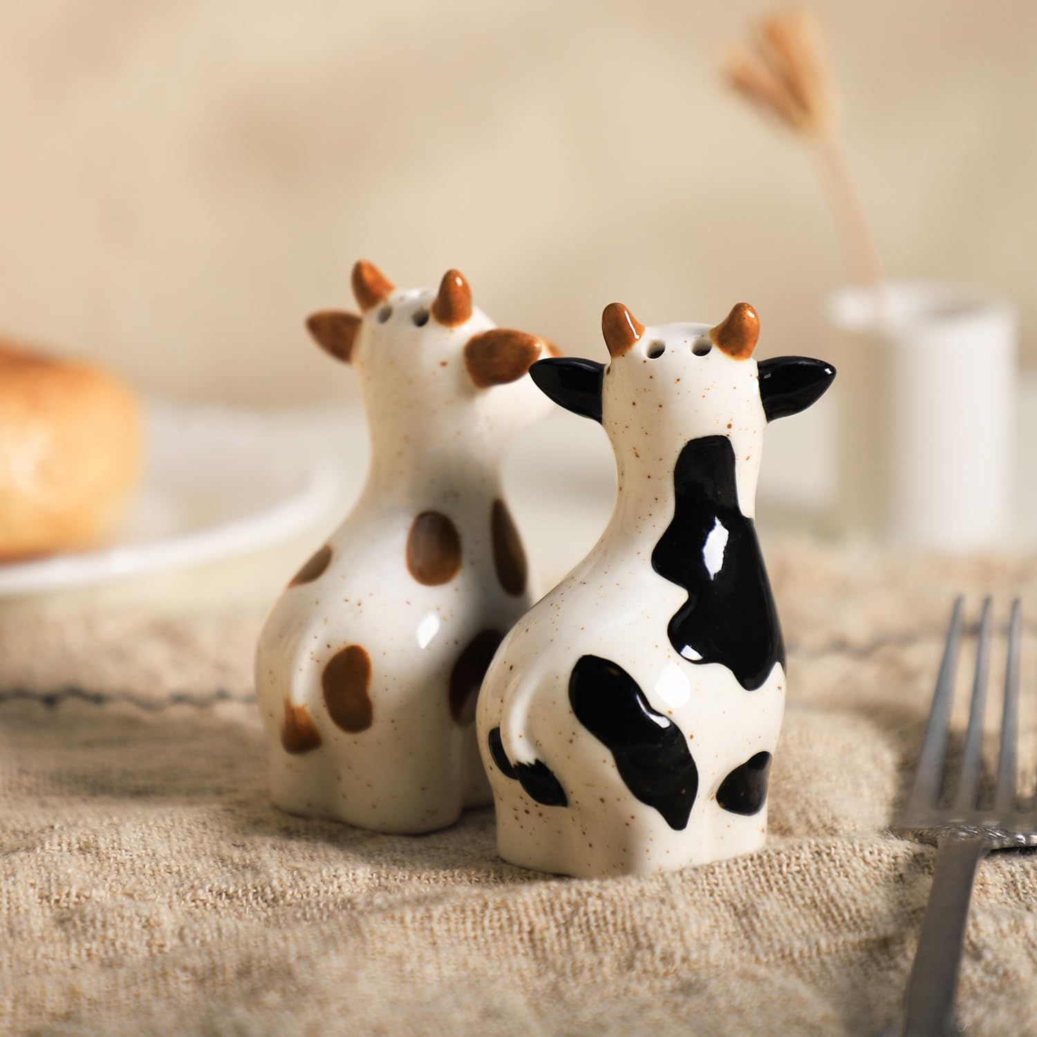Bicuzat ceramic cow shakers in brown glaze are durable and decorative
