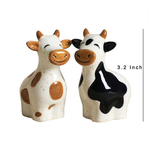 Bicuzat hand-painted cow salt and pepper shakers add playful dining appeal