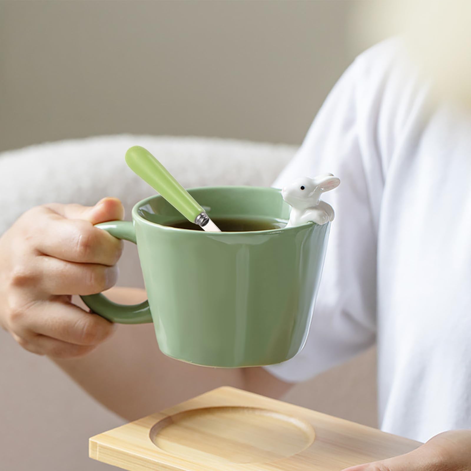 BigNoseDeer kawaii ceramic mug with lid and spoon for convenient sipping.