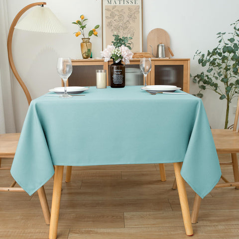 Biscaynebay Aqua Blue tablecloth draped over a dining table for an elegant look