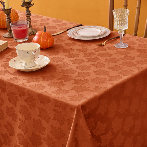 Biscaynebay fall tablecloth in an indoor dining scene with warm lighting