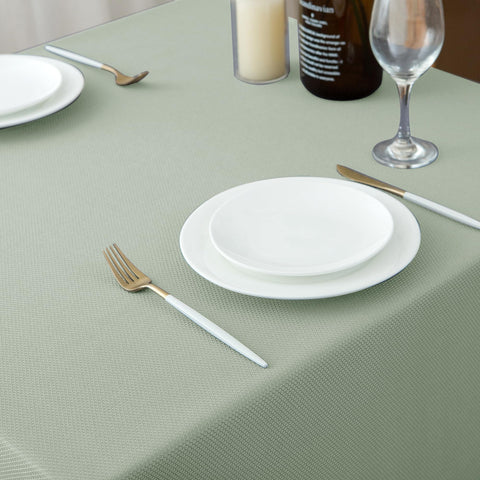 Biscaynebay family dining scene with sage card fabric tablecloth.