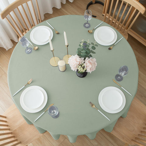 Biscaynebay outdoor dining setup with sage cloth creates elegant ambiance.