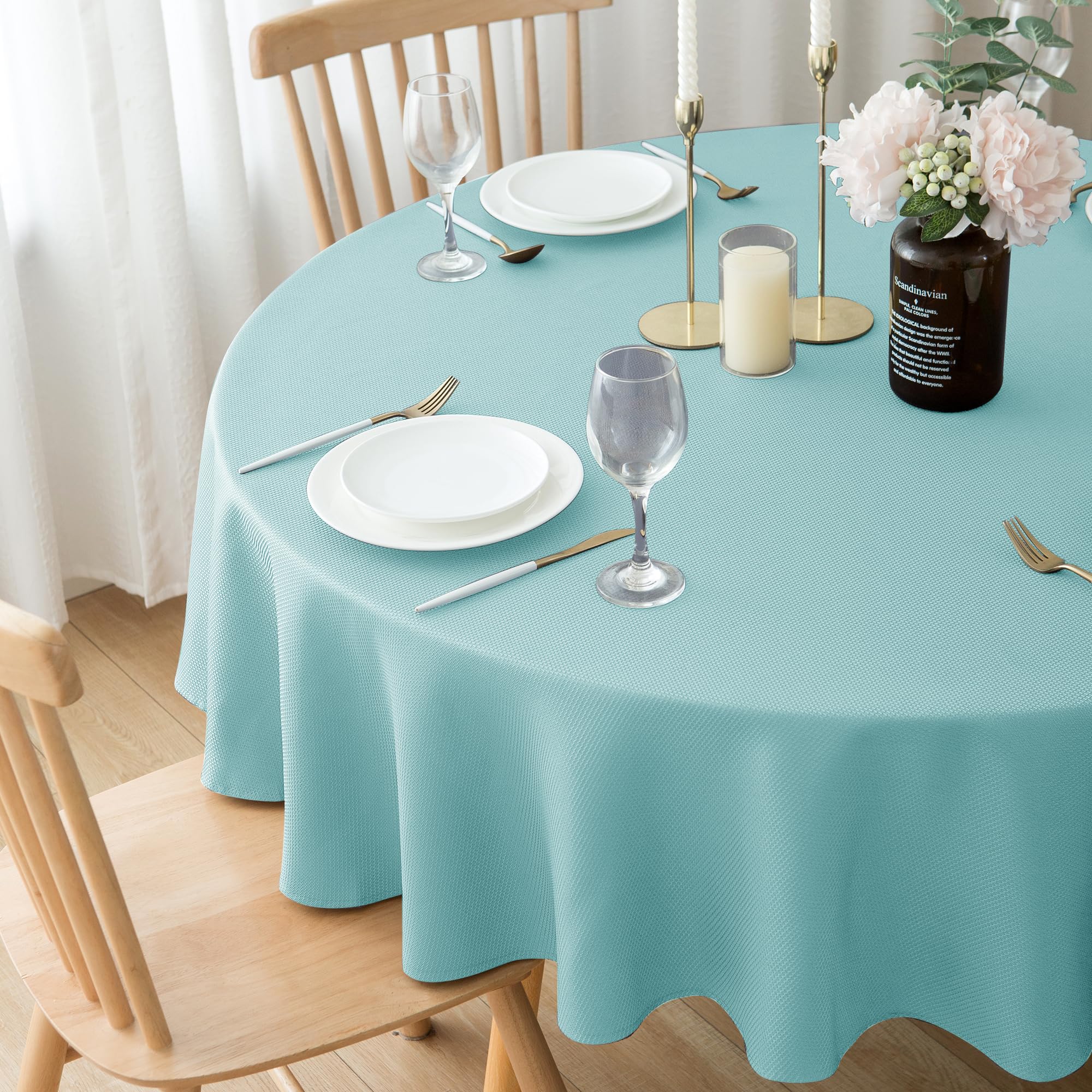 Biscaynebay round tablecloth water-resistant surface protects tables from spills.
