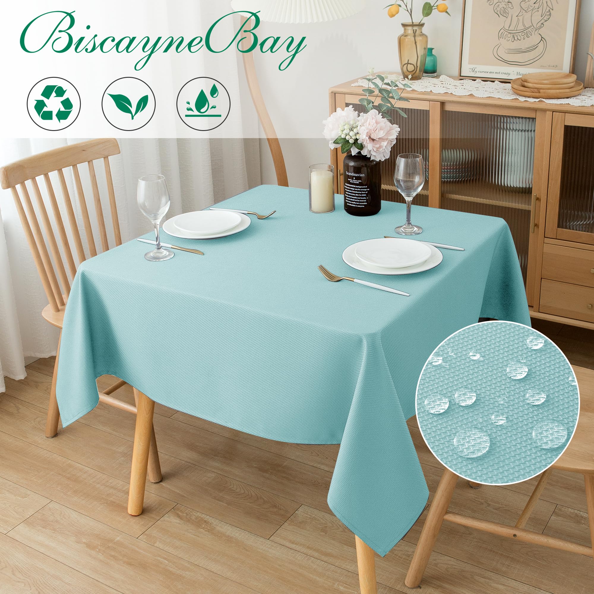 Biscaynebay Auqa Blue tablecloth folded on table for an elegant dining setting
