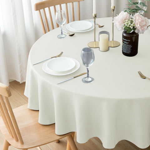 Biscaynebay ivory dining ambience with round textured tablecloth
