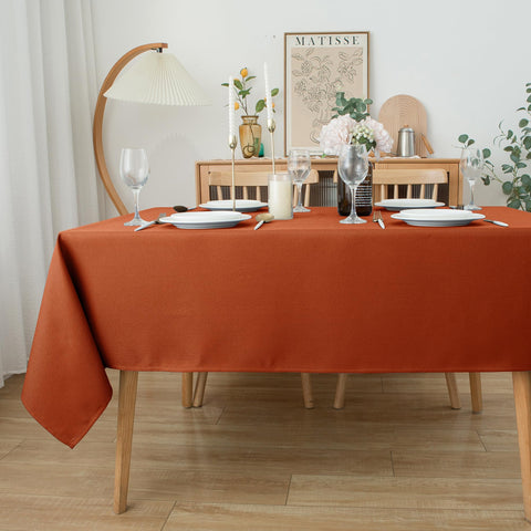 Biscaynebay wedding reception table setting with rust tablecloth exudes sophistication