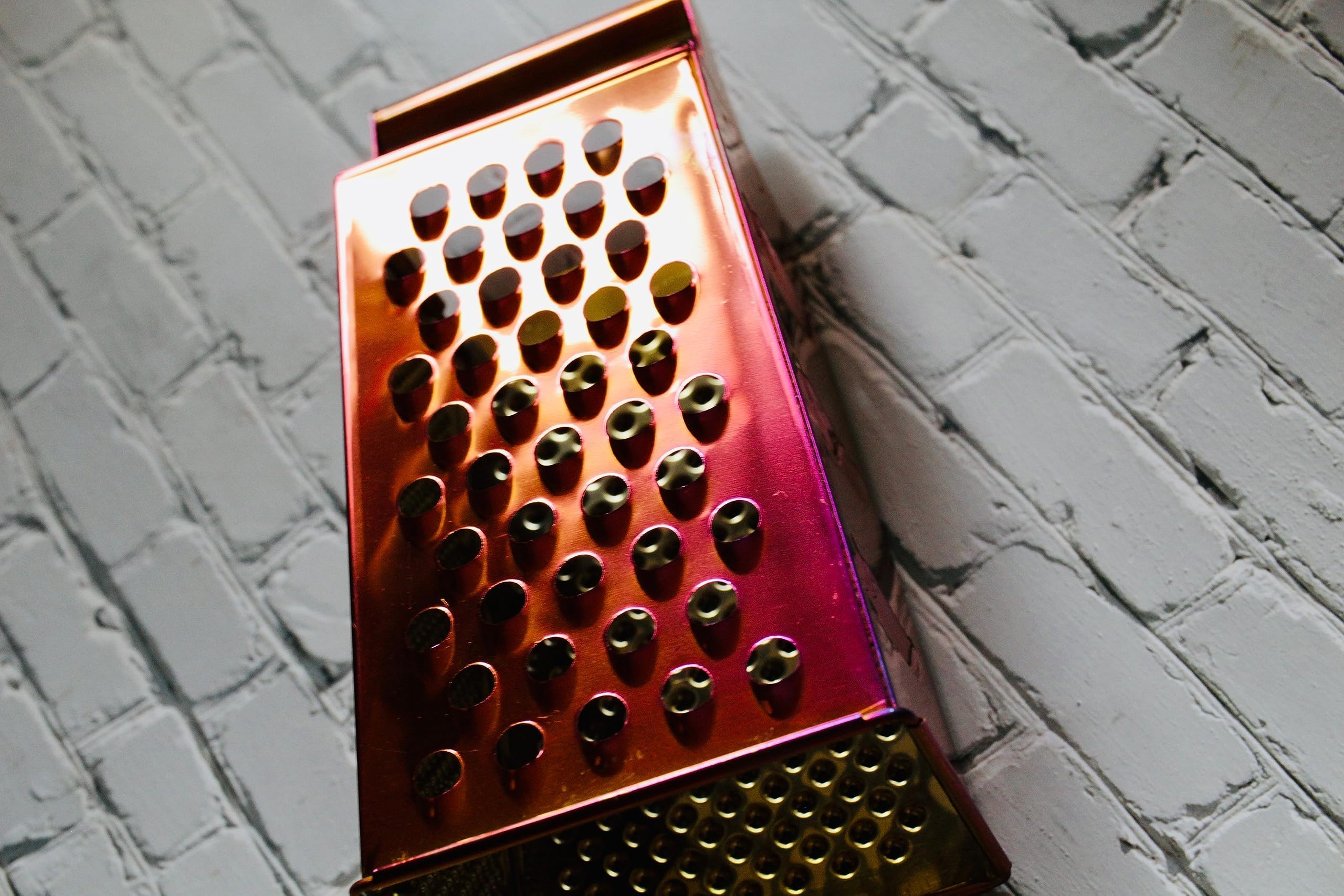 BISDARUN gold grater shaves cheese into delicate ribbons