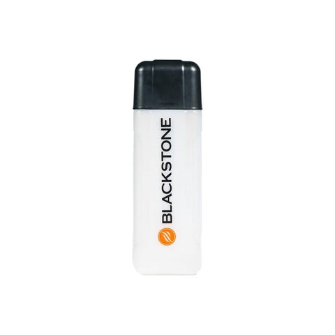 Blackstone culinary squeeze bottle on grill for drip-free marinades and glazes.
