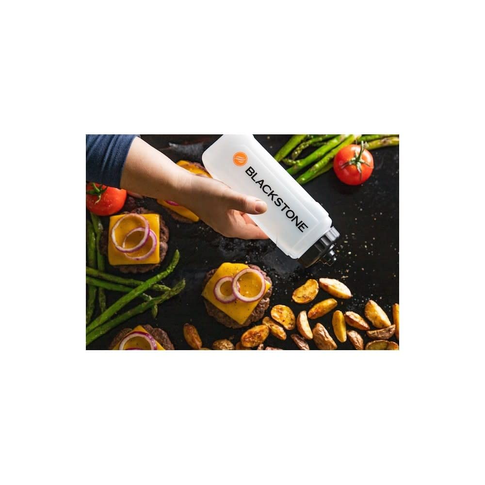Blackstone bottle in kitchen setup supports quick oil application during grilling.