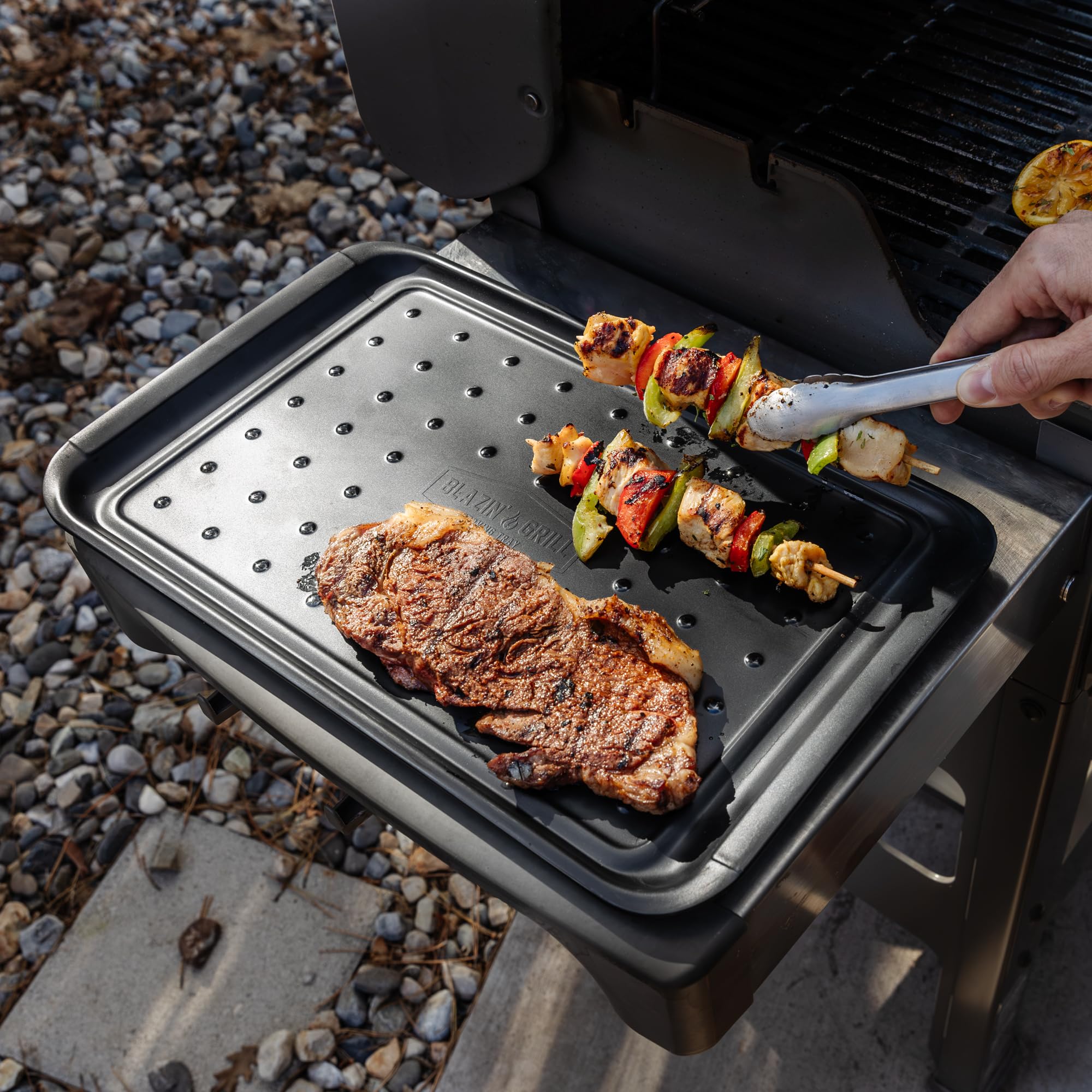 BLAZIN' GRILL versatile system supports marinating, chopping, and plating.