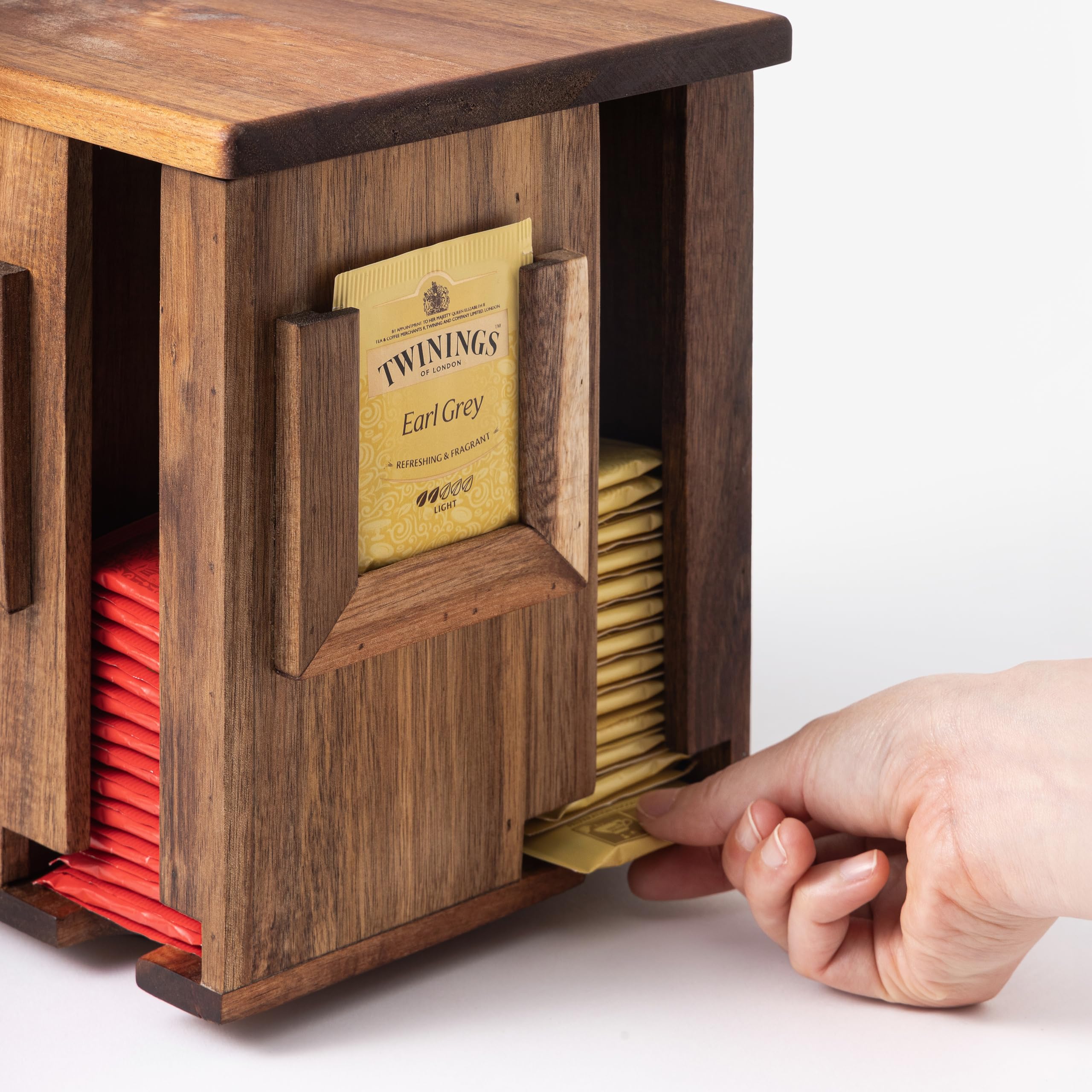 Blissli four-sided tea-slot display showing organized flavors at a glance.