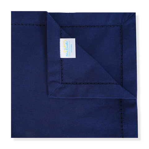 Blue Needles navy hemstitch napkins stacked and ready for serving or gifting