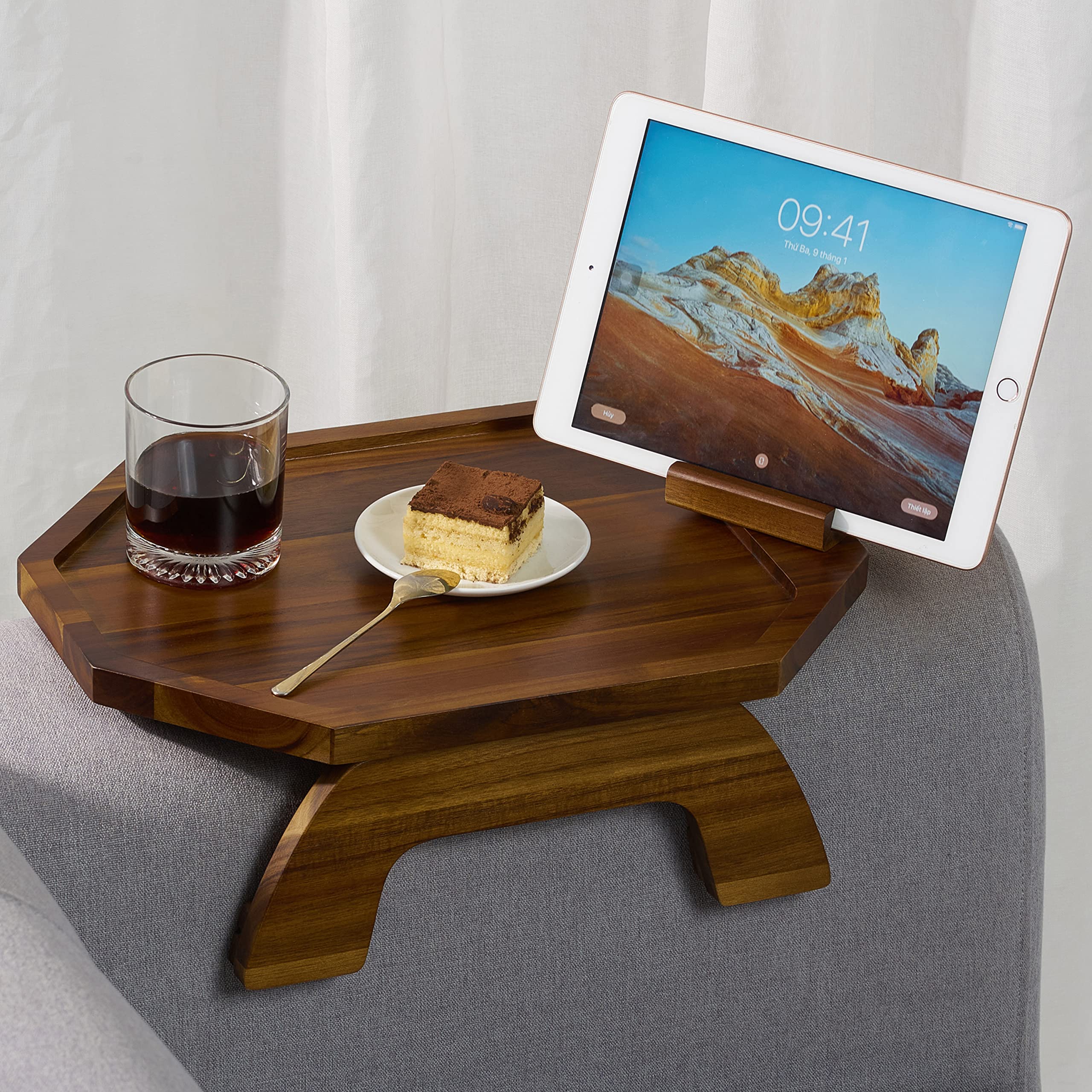 BLUEWEST sofa armrest tray in acacia wood provides a durable surface for meals and devices.