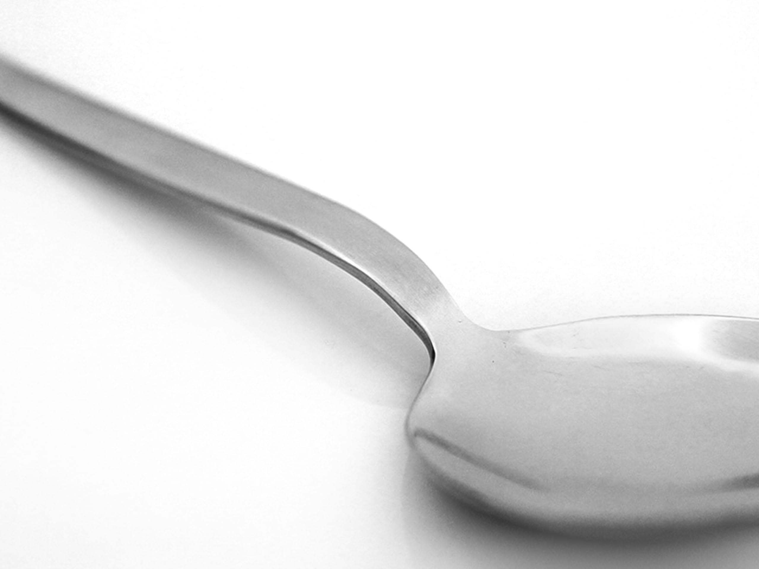 Brushed nickel handle on Kunz spoon provides a comfortable grip for long use.