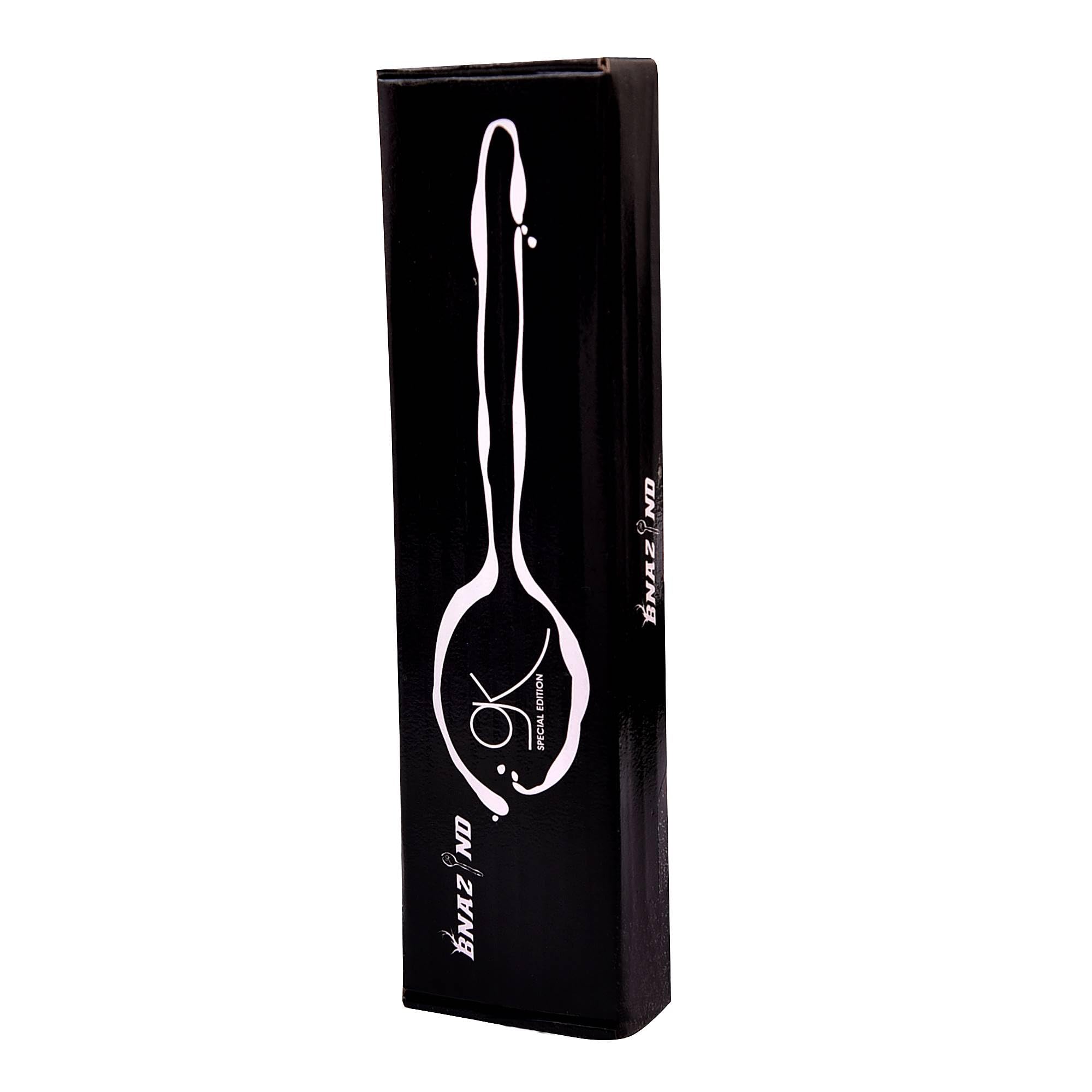Kunz spoon in a kitchen scene prepared for sauces and plating.