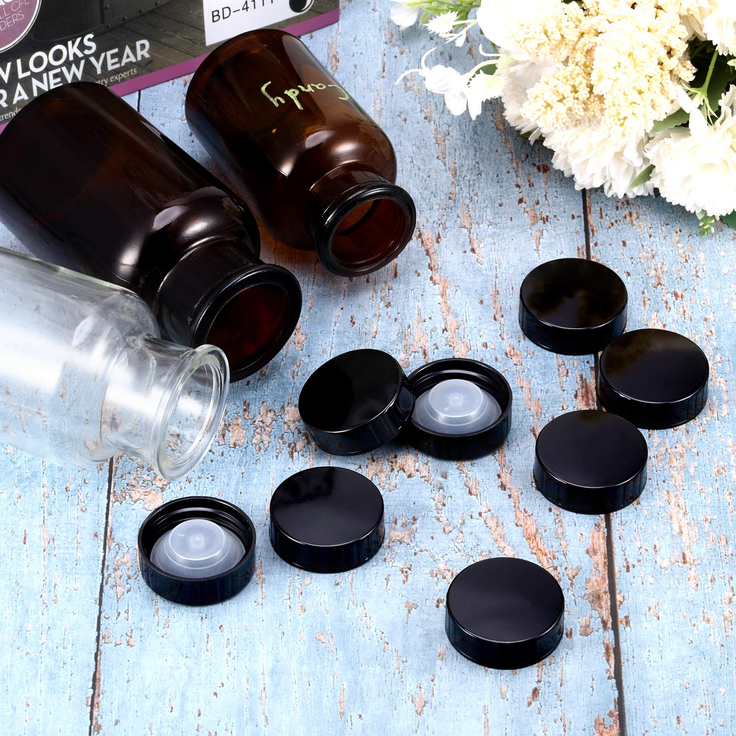 Boao amber Boston round bottle with seal cap demonstrates airtight closure.