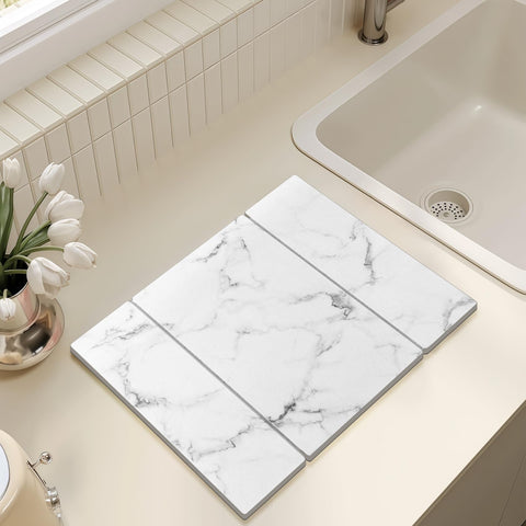 Bomoks water-absorbent drying stone protecting counters from moisture during washing.