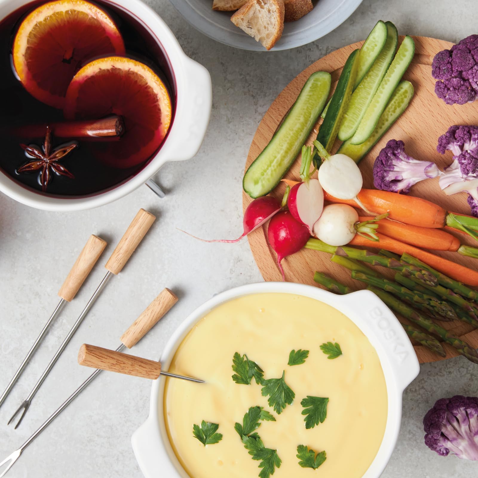 Boska ceramic fondue pan withstands open flame, stove, and oven cooking.