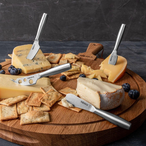 Boska mini Copenhagen knives on table, ideal for appetizers and cheese boards.