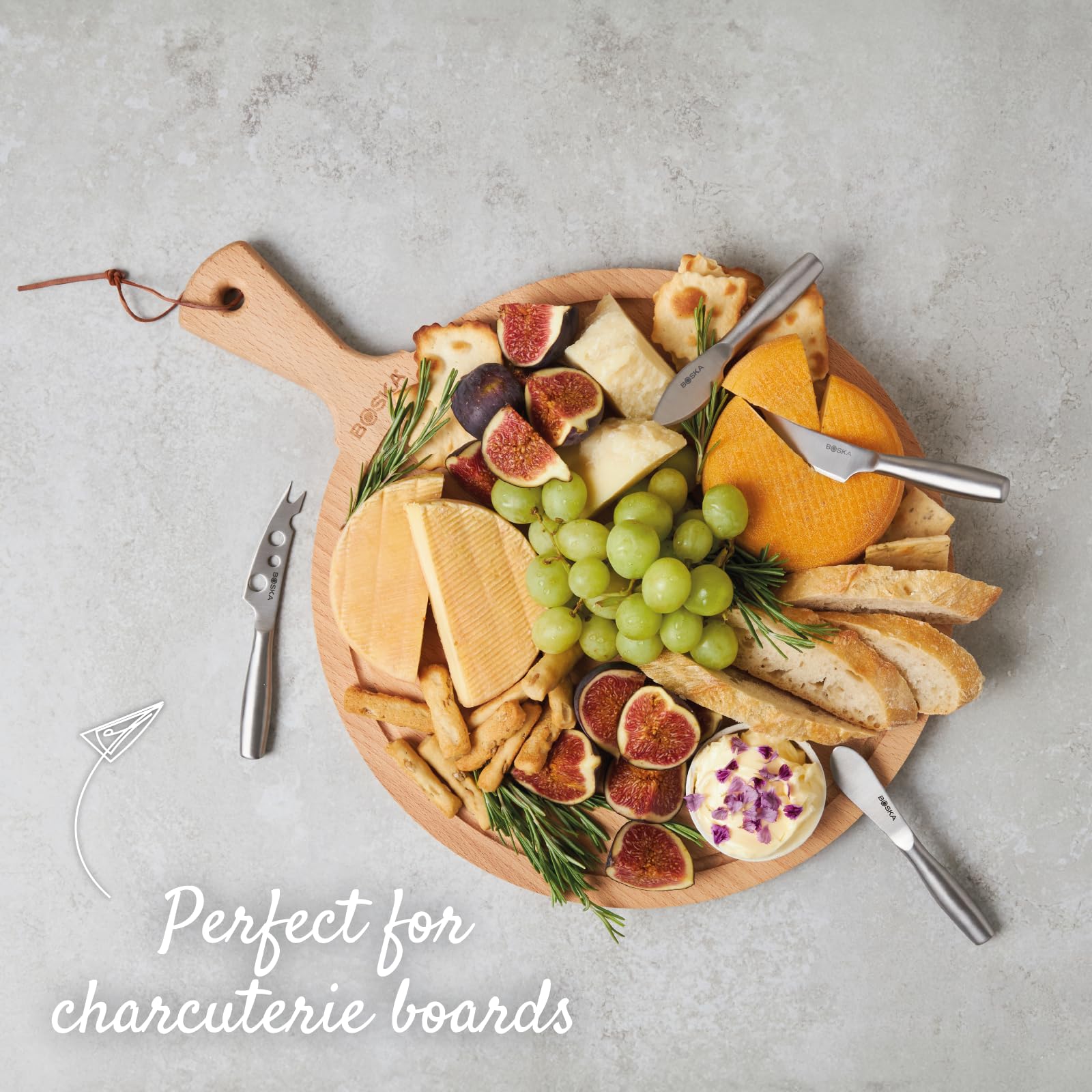 Boska table-ready mini knives on appetizer board.