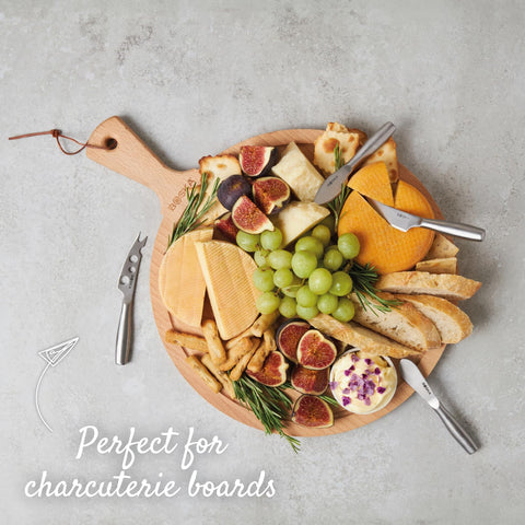 Boska table-ready mini knives on appetizer board.