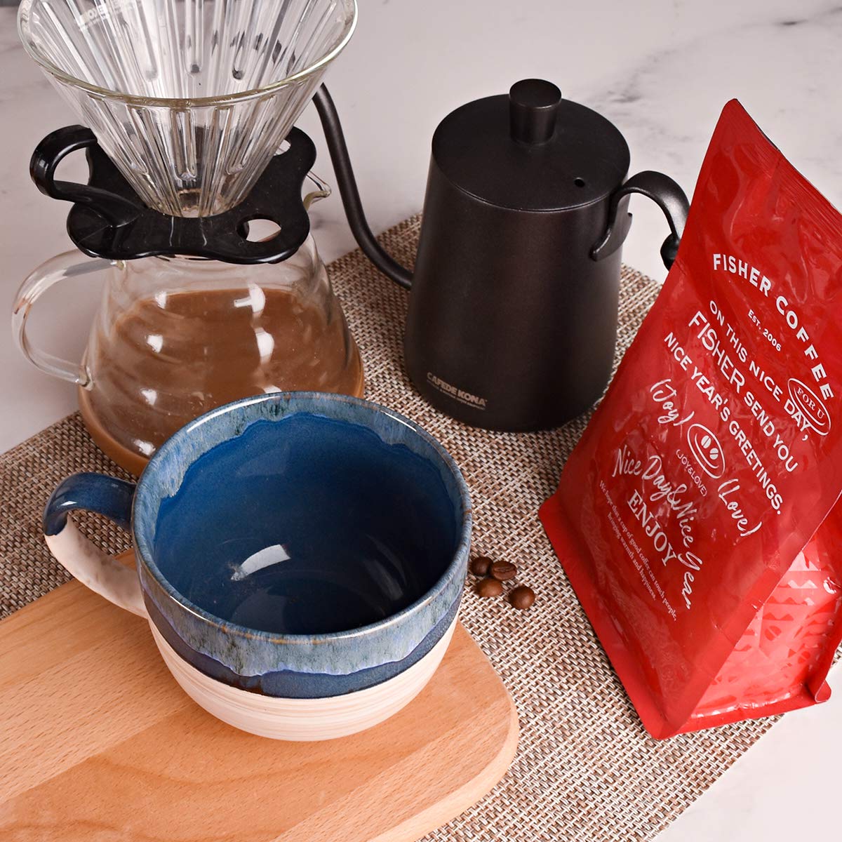 Bosmarlin Prussian Blue mug in use for hot beverage.