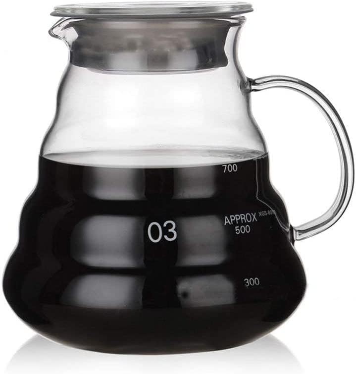 Boxtree 800ml clear glass coffee server held for pouring into cups
