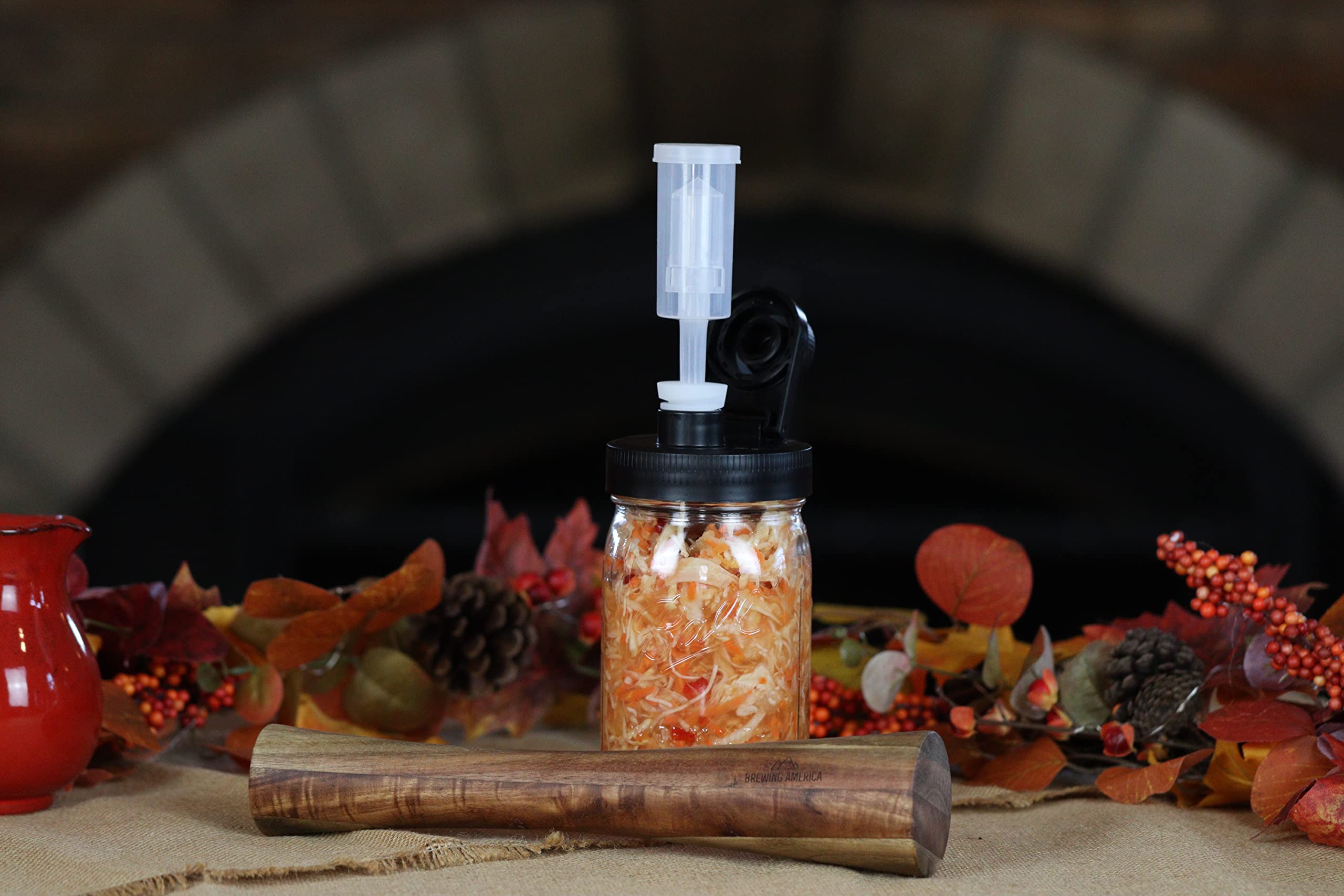 Brewing America acacia wood tamper ergonomic handle for comfortable use.