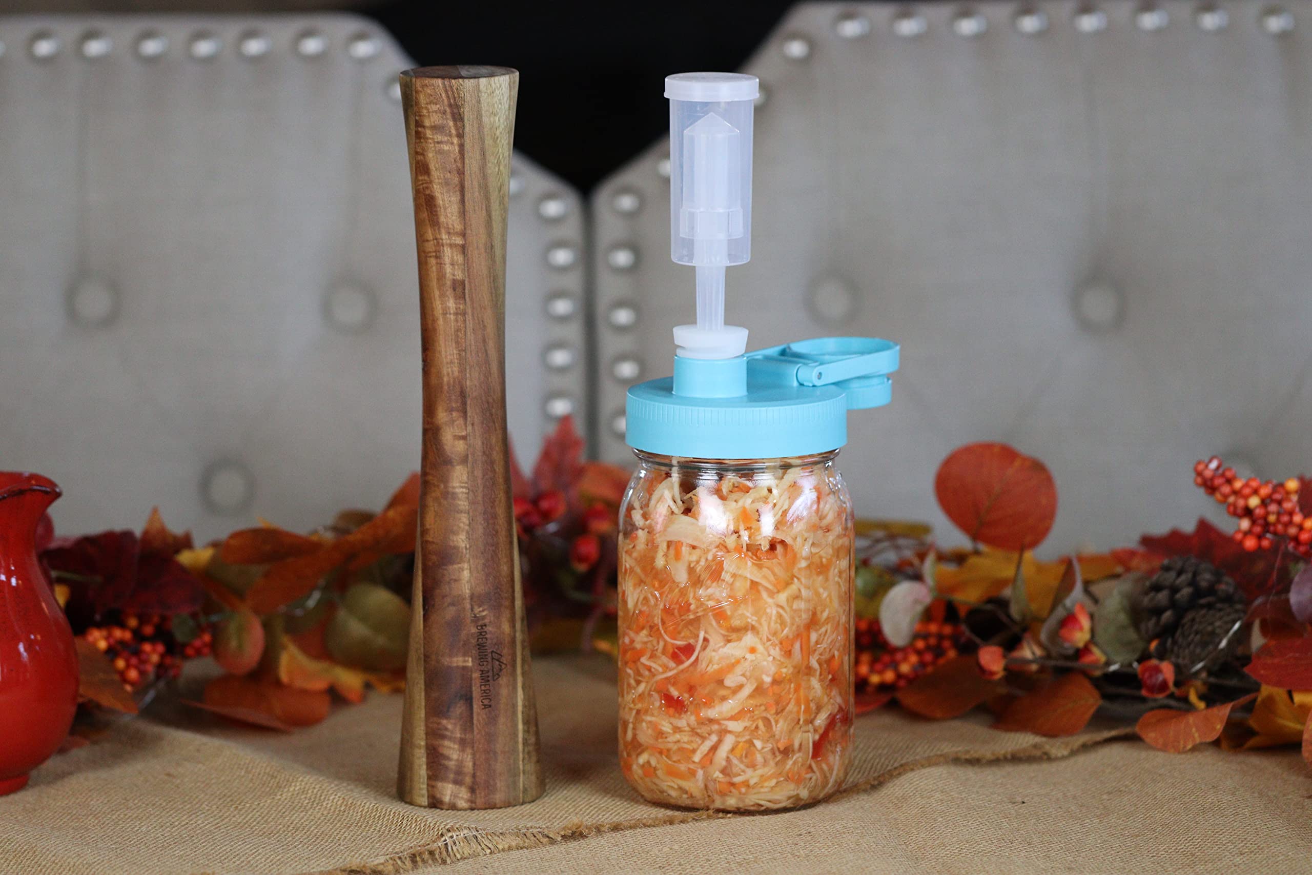 Brewing America acacia wood tamper shows natural grain and renewable wood.