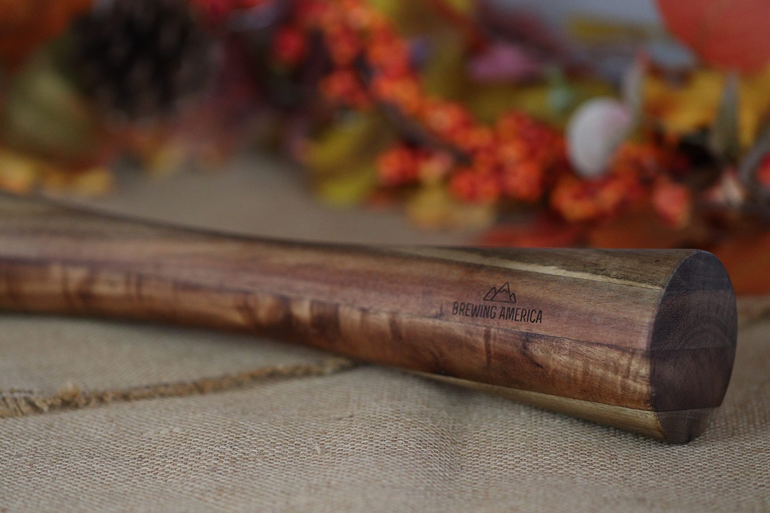 Brewing America acacia wood tamper wide-mouth end fits 2.5-inch jars for efficient stuffing.