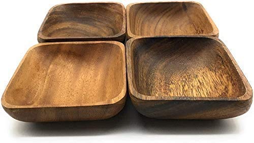 Natural acacia wood bowls highlighting grain for versatile serving.