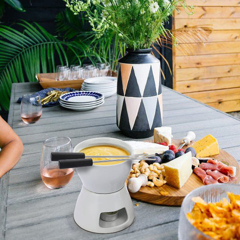 BSTKEY picnic scene with fondue set for outdoor snacking.