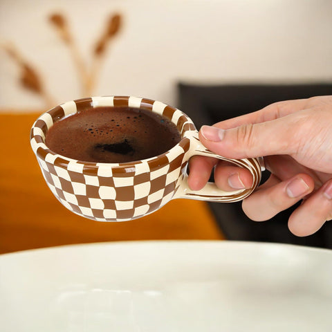BuleVina checkered mug warm tones, cozy ambiance for hot beverages.