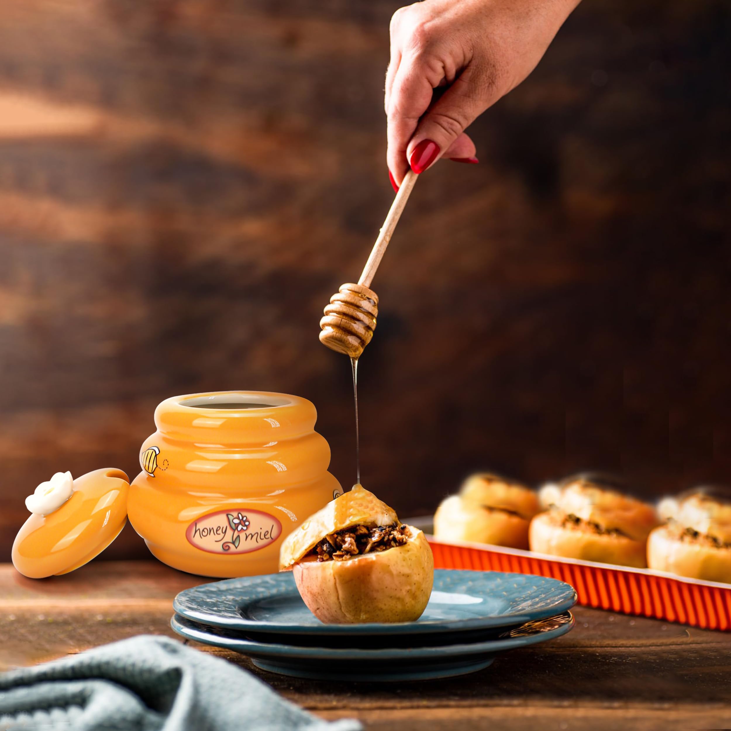 Orange ceramic honey jar ready for tea and toast.