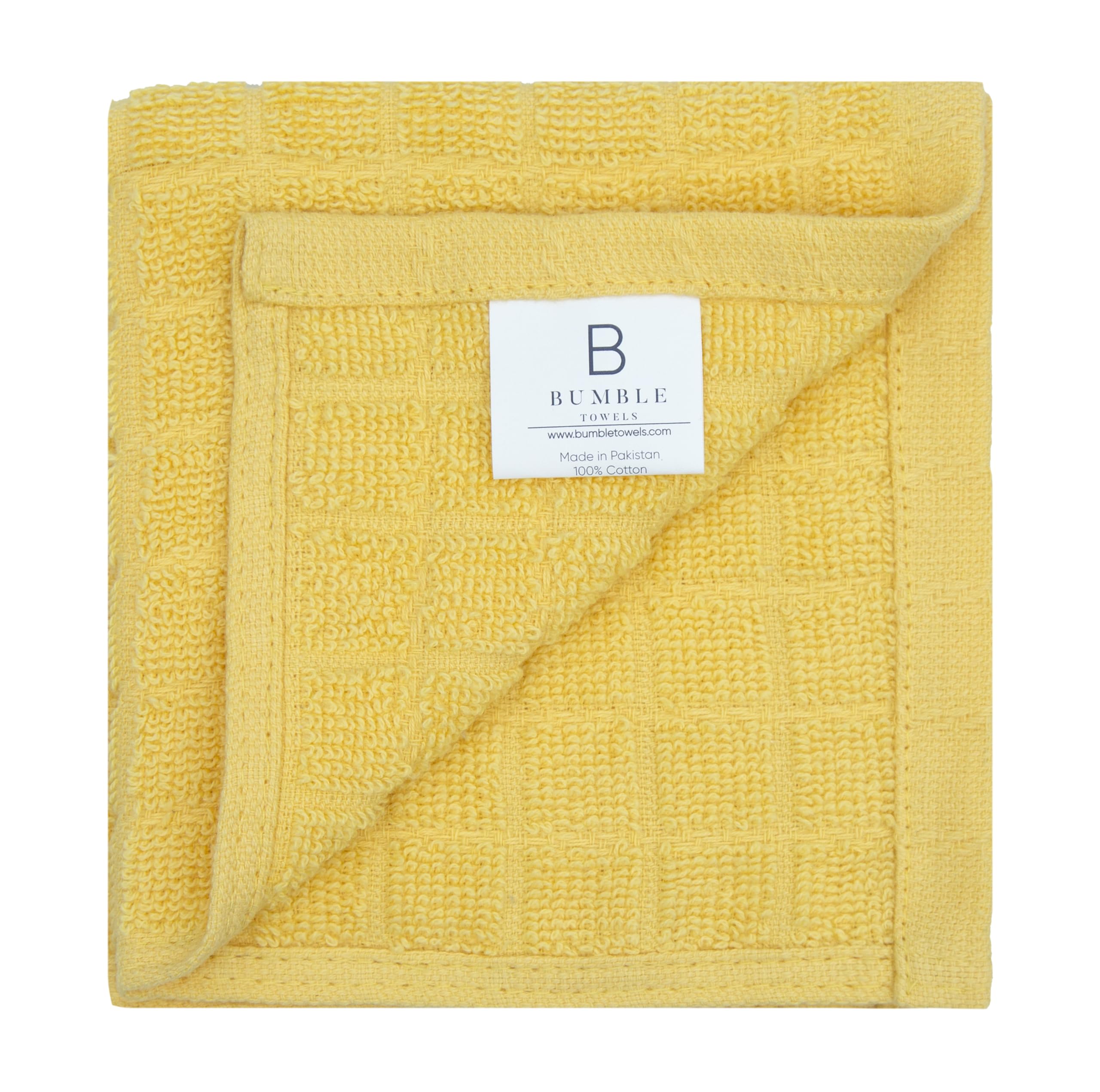 Bumble Towels yellow absorbent towels demonstrate efficient spill wiping.